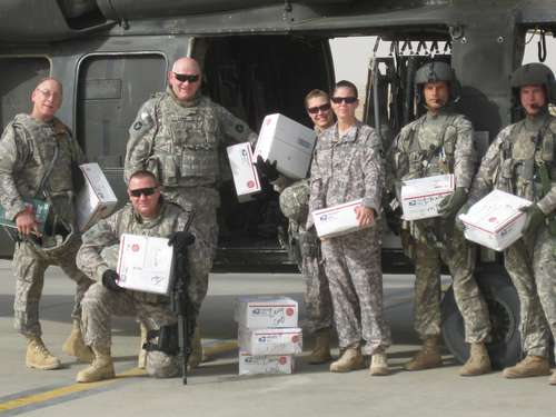 Minnesota Unit poses with received AnySoldier packages October 2009, Afghanistan Photo used courtesy AnySoldier.com